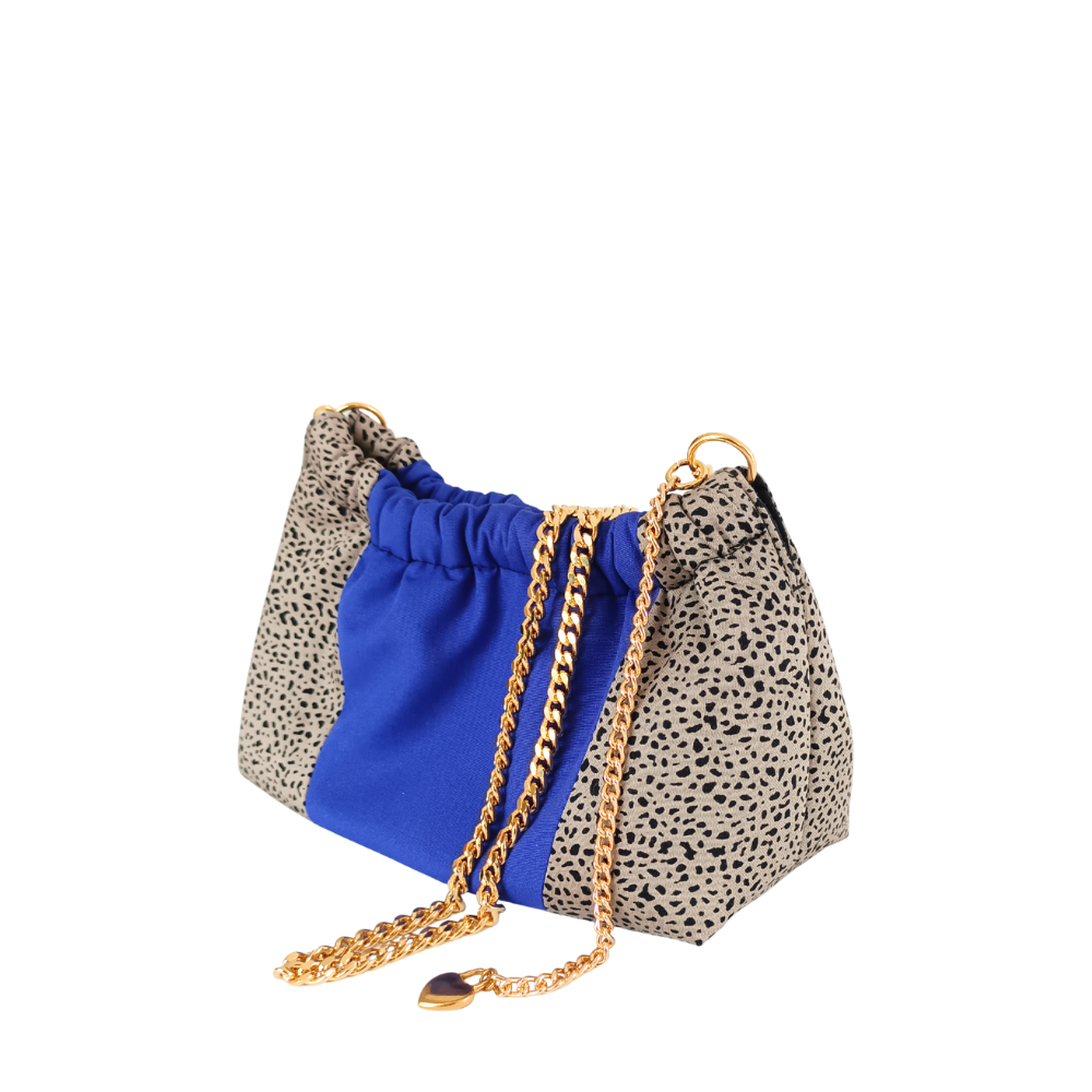Sac à main violet de la marque écoresponsable La Machine à récup qui revalorise des tissus avec la participation d'ateliers solidaires.