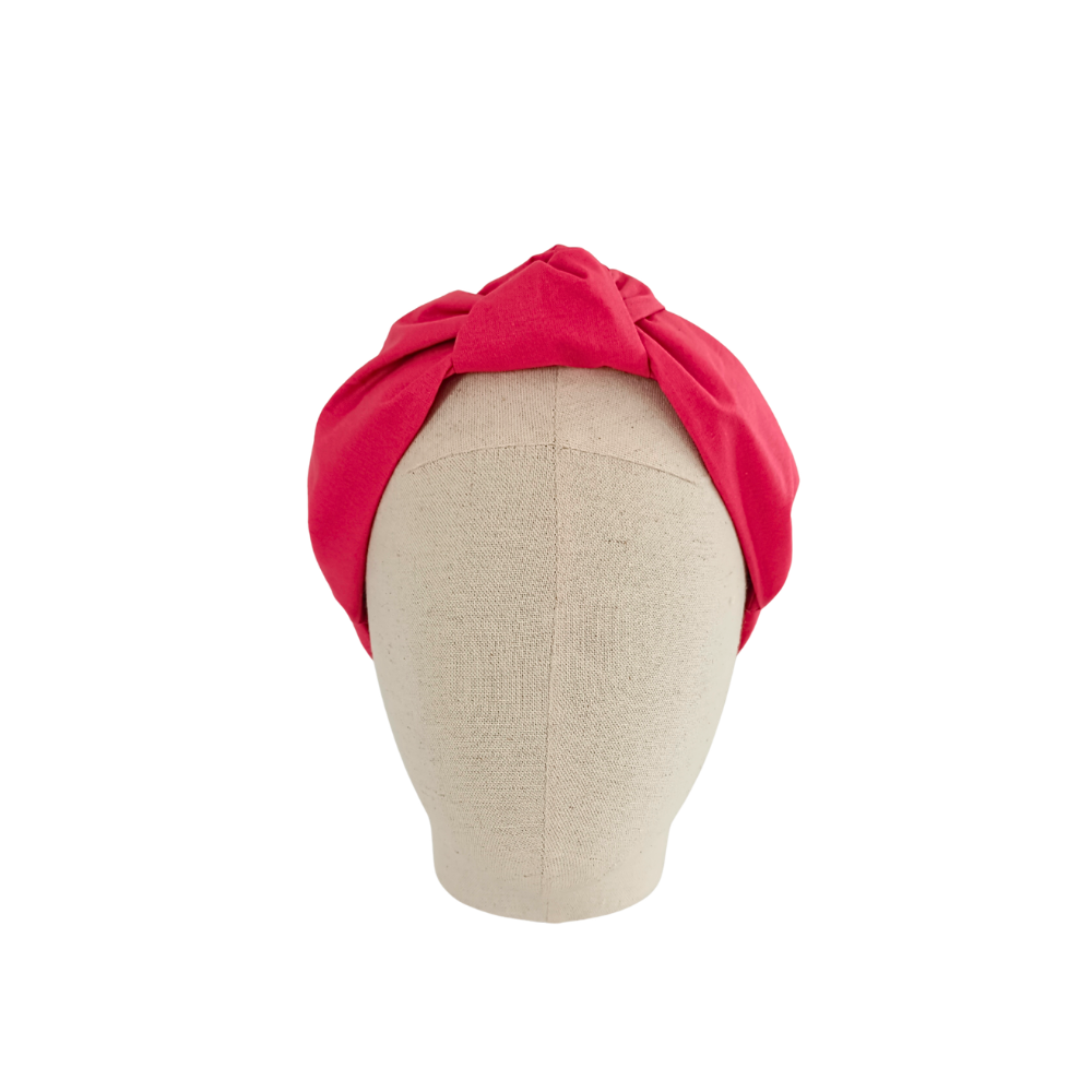 serre tête rose de la marque écoresponsable La Machine à récup qui revalorise des tissus avec la participation d'ateliers solidaires.