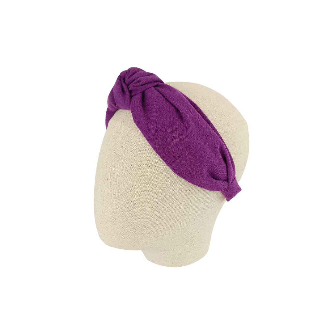 serre tête violet de la marque écoresponsable La Machine à récup qui revalorise des tissus avec la participation d'ateliers solidaires.